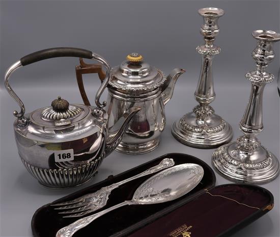 A pair of Sheffield plated candlesticks, a plated coffee bigin and sundry plated wares, including plated cutlery